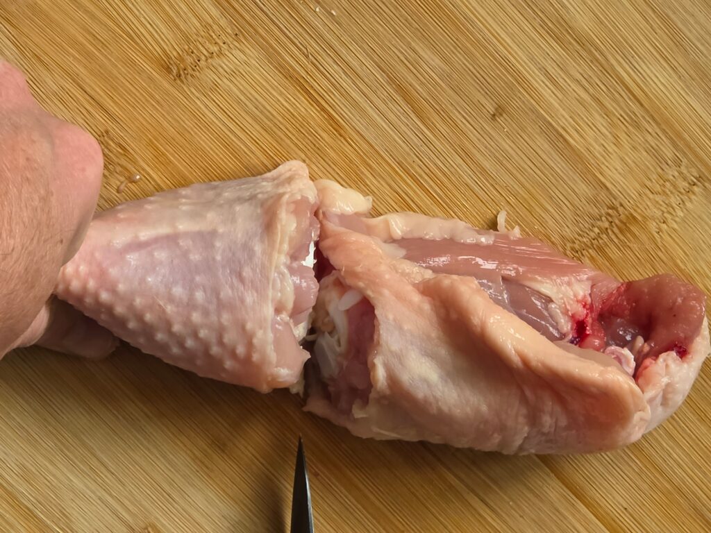 separating chicken thigh and chicken drumstick